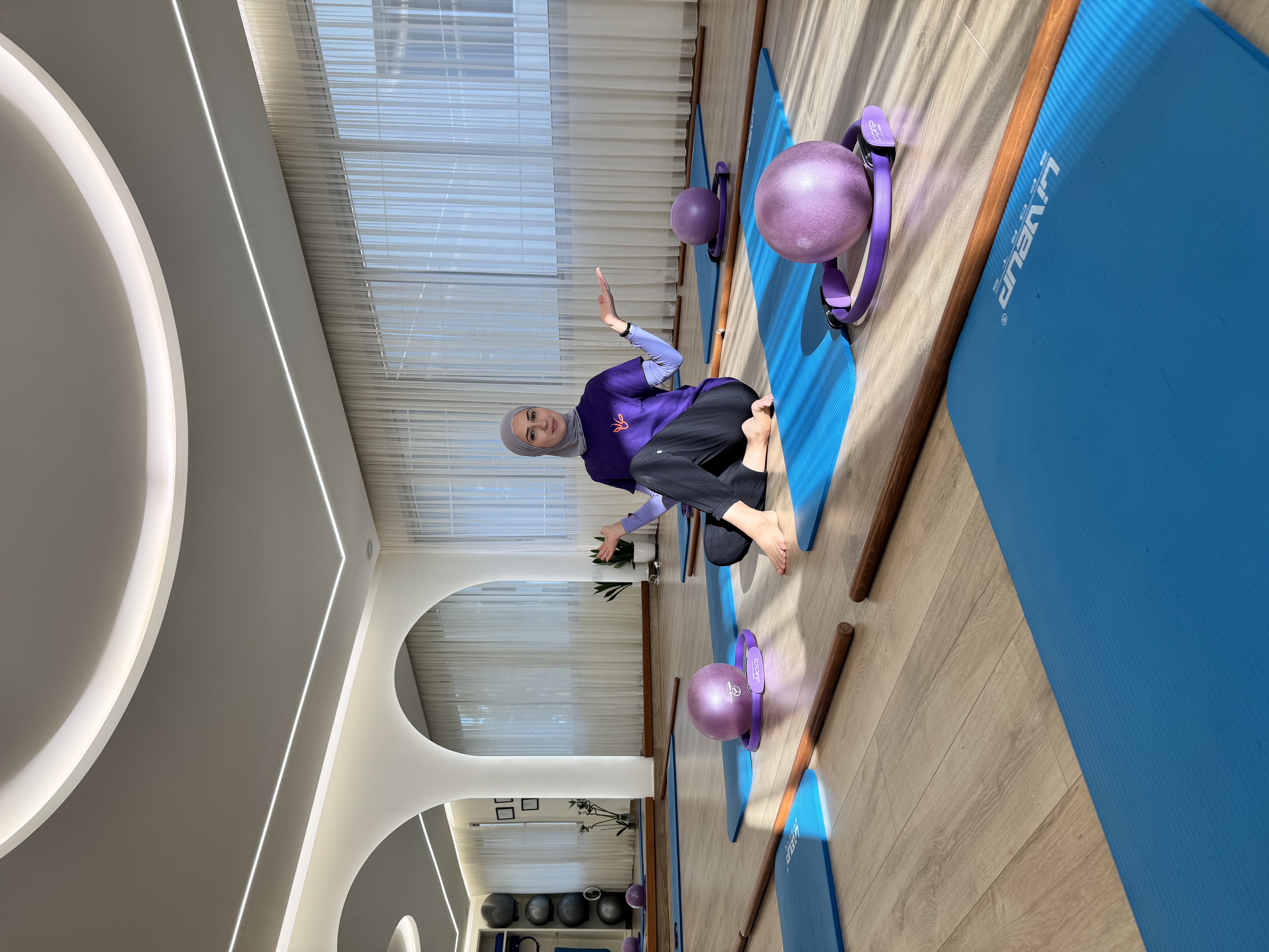 Lama surrounded by Pilates balls and mats in her Hazmieh studio